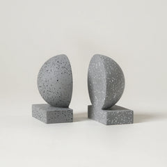 Two gray Monolith Concrete Bookends on a light gray background