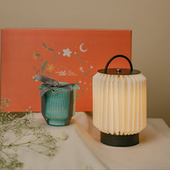 Decorative Portable Table Lamp beside a wrapped Flower Cut Votive Candle, perfect gift in an orange decorative gift box in the background.