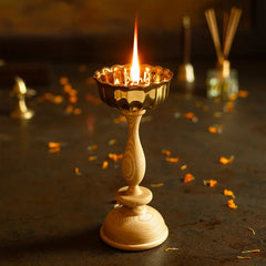 Dipam - White Oak, lit big brass oil lamp on white oak stand with marigold petals