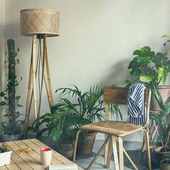 Mushroom Floor Lamp with the woven basket shade in an outdoor setting

