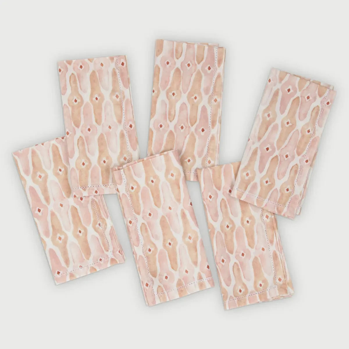 Mosaic Blush Cotton Table Napkins Set of 6 laid out, hand-painted lattice print