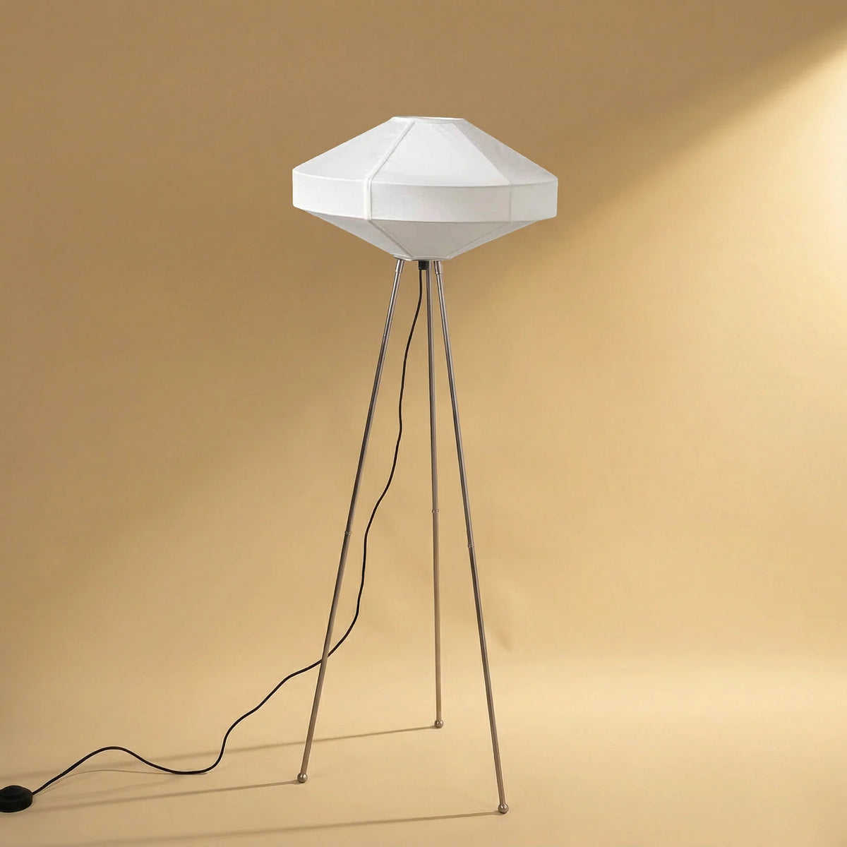Modern floor lamp with nickel finish and geometric white fabric shade