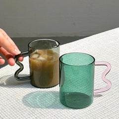 Stylish Swirl Glass Cups in teal color and pink unique design handle