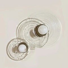 Two clear glass Ripple Textured Alabaster Stone Wall Sconce light with white glass bulbs