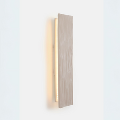 Side look of beige color Vertical Wall Sconce mounted on a wall