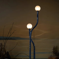 Reva Floor Lamp with 2 frosted glass sphere bulbs that casts a calm, diffused glow