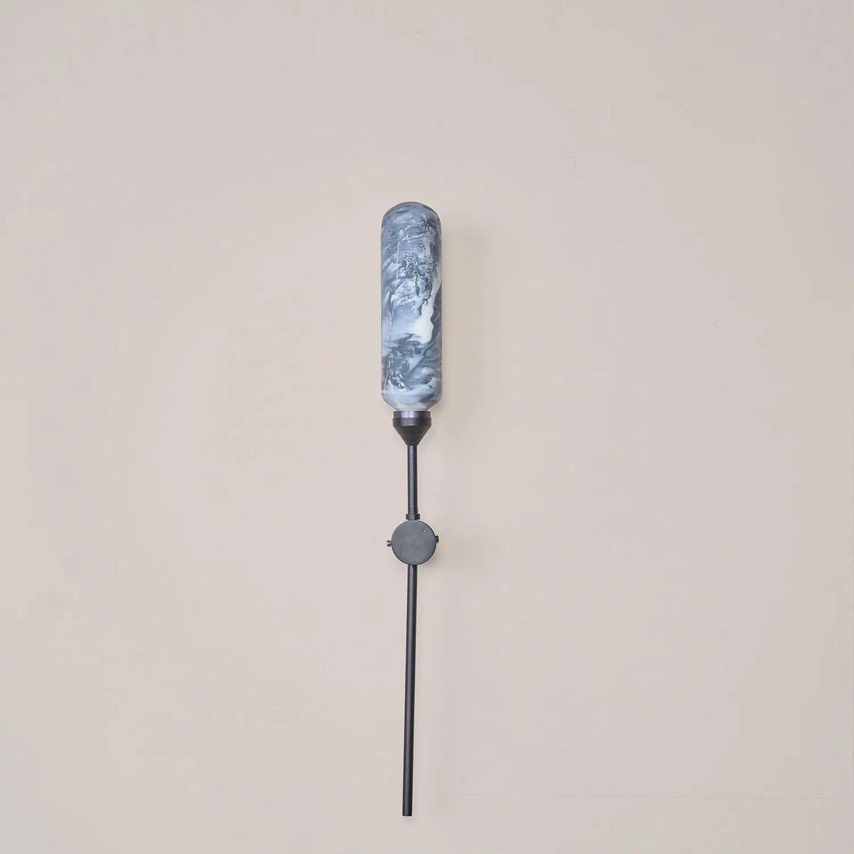Outdoor Wall Lamp features hand-painted black and white marble glass that mimics natural striations