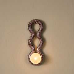 Decorative Reva Double Loop Wall sconce, handcrafted in glass mosaic with glowing glass globe