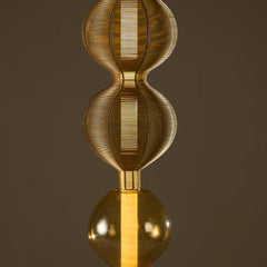 Decorative gold Notto floor lamp crafted in glass & mild steel wires