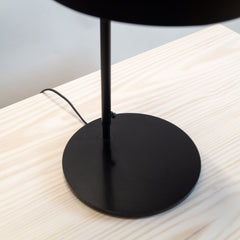 Svelte Scandi Table Lamp made of black base and rod, close view.