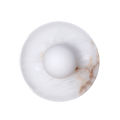 A Blot Wall Sconce with a round shade, featuring a mottled white stone material with hints of brown.