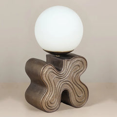 Eton Table Lamp, side look. Made of aluminum base, finished in antique brass with smooth glass globe 