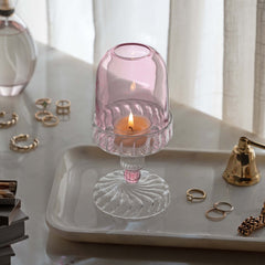 Fairy Lamp -pink glass candle holder with lit candle placed on marble tray