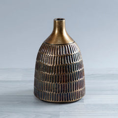 A decorative ceramic Vasiliki Vase with a textured, ribbed body and a flared metallic gold neck, set against a light gray background.