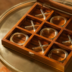 Selva Tic Tac Toe, brass X's and O's on polished wood