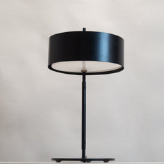 Unique Svelte Scandi Table Lamp  with a black shade and base.