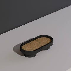Top view of Podium oval tray in bold black body and brown base for serving, or jewellery display.