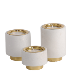 Decorative set of three pillar-shaped  tealight candle holders with marble body and brass base and rim