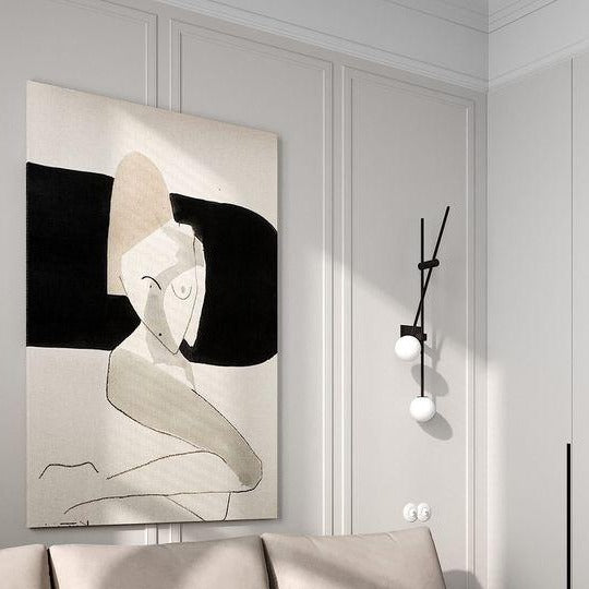 Frosted glass wall lamp casting warm ambient glow beside sofa