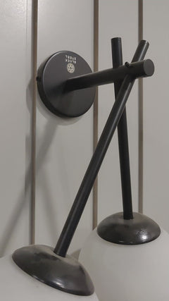 Close-up of double-glass wall lamp showing clear glass shades and brass arm in a small video clip