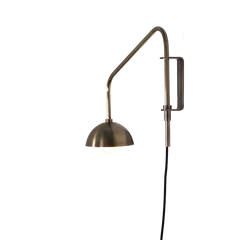 A single-arm wall sconce with a brass dome, providing illumination.