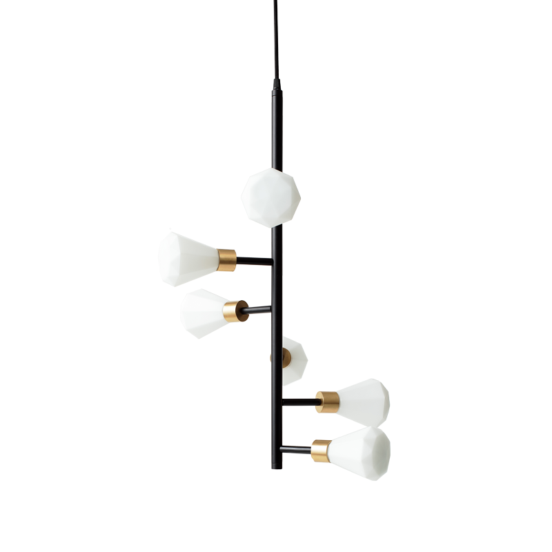 A pendant lamp with opal glass shades and brass details, suspended by a black cord.