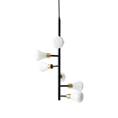 A pendant lamp with opal glass shades and brass details, suspended by a black cord.
