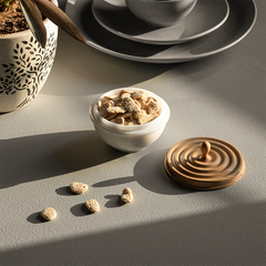 Small decorative Ripple Container, a handcrafted storage container with a white marble base and a natural wood lid.