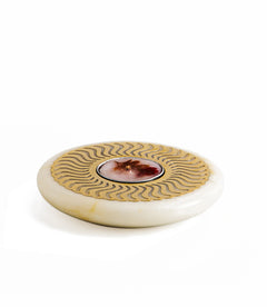 Unique round Celestial Plate, a white marble plate with a floral pattern in the center and a brass sheet on top, featuring a red flower design.