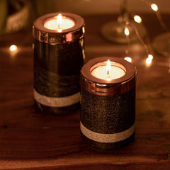 Yin Tealight Towers, lit candles with warm glow on a wooden table