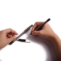 Two Oronoir Pen, one a person is holding in writing position and another is placed on white background