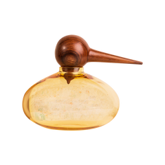 Decorative bottle with a wooden bird shaped top and glass body on a white background