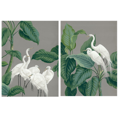 Two framed paper crane design wall art prints surrounded by foliage.