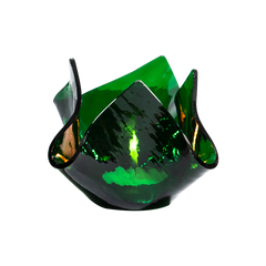 Green glass crumpled candle votive with wavy design on a white background