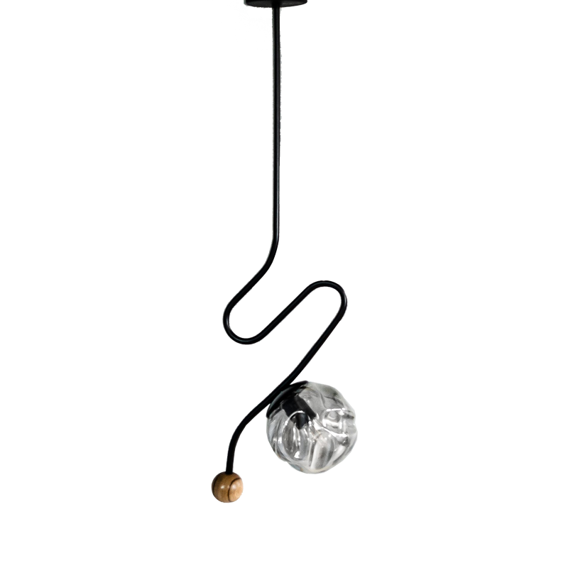 A black matte pendant light with a wavy iron base and a tinted black glass shade, featuring a teak wood knob.