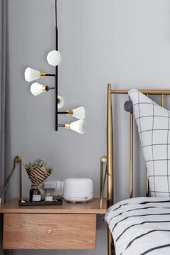 Spiral Pendant Lamp placed above bedside table