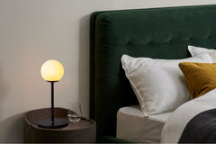 Contemporary Table Lamp with white frosted glass placed on bedside table